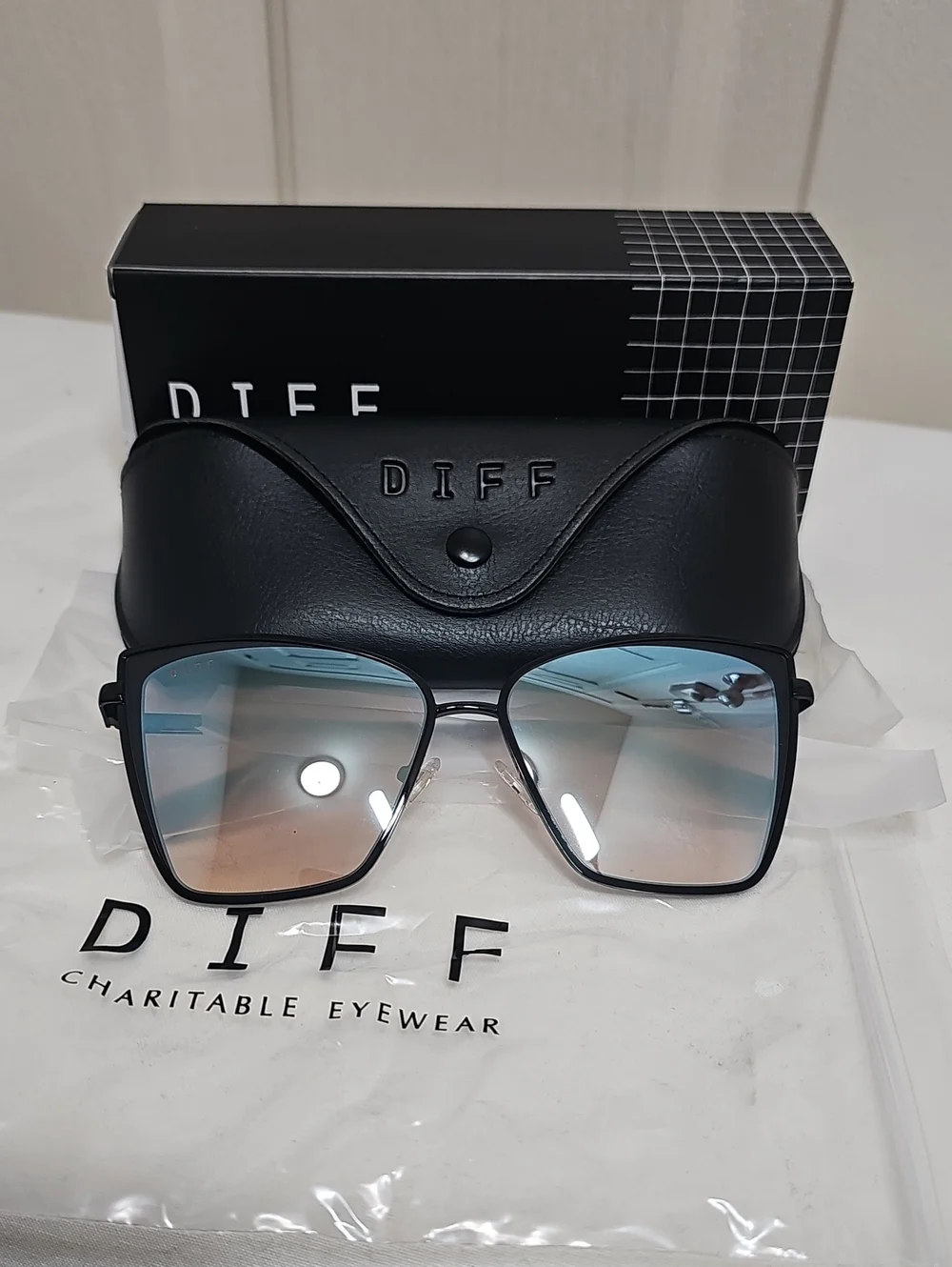DIFF Charitable Becky Eyewear Black Frame Sunglasses with Blue-Gradient Lenses